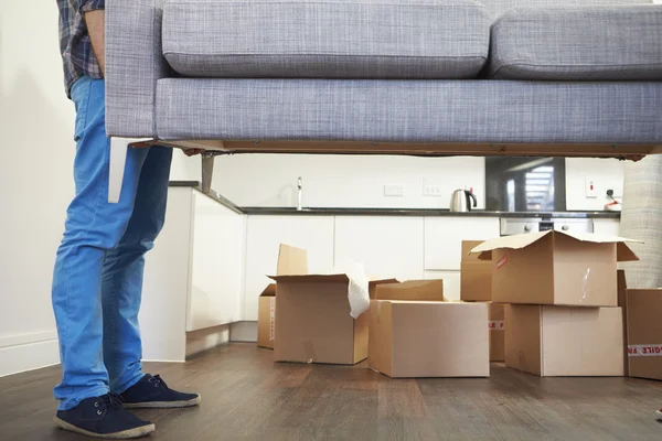 Mover carrying a sofa